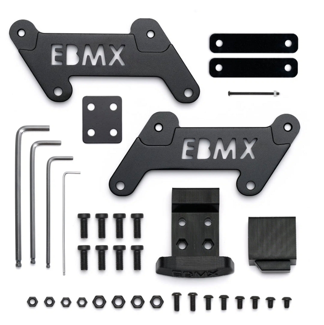 EBMX Surron stealth black seat extenders look the part, and push the rider 1.5” further back and 2” higher